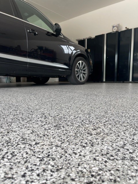 Domino color concrete coated garage with car