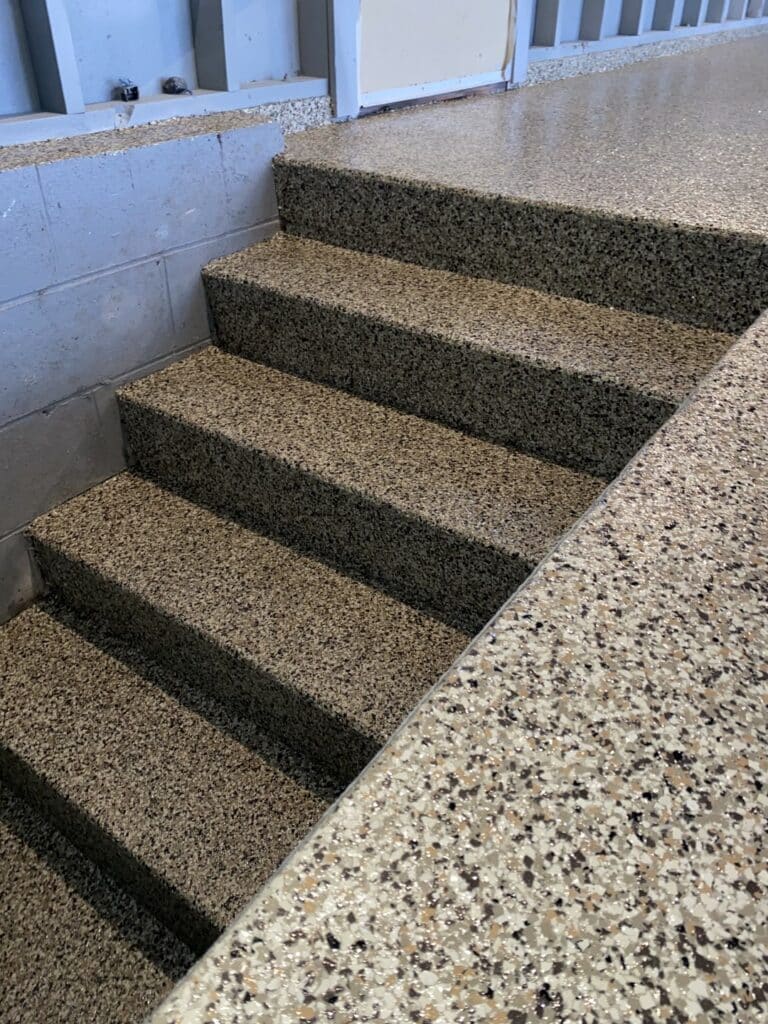 Coffee bean color concrete coated stairs showcasing our concrete floors process.