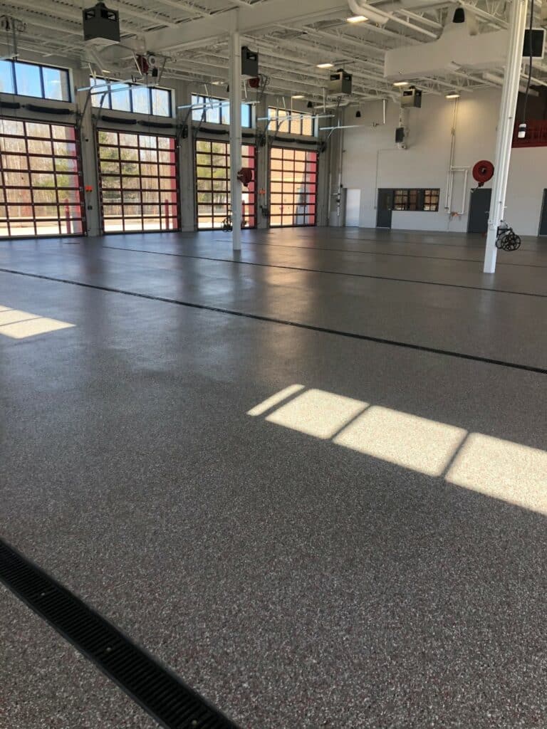 Pictured is a fire house with coated concrete--the same polyurea garage floor coating used in residences.